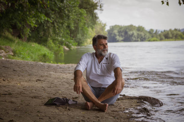istock Mature silver beard man enjoy close to river 1416058095