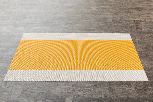 istock Perspective view of yellow tablecloth for food on cement background. Empty space for your design 1416064954