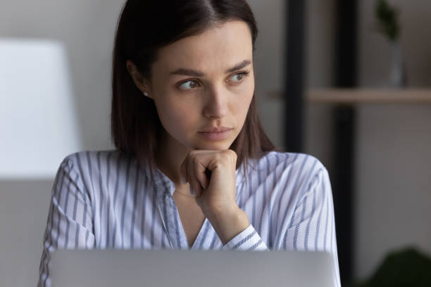 istock Thoughtful young business woman working on computer. 1416065732