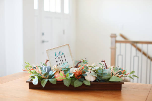 istock Fall dining room with Thanksgiving centerpiece and HELLO FALL message in a bright modern home 1416068028