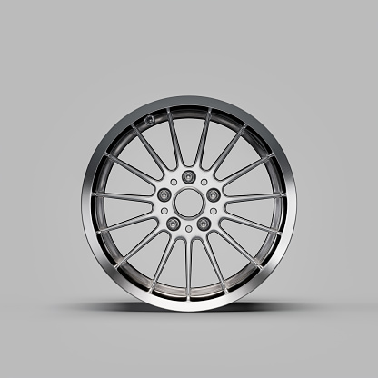 Shiny silver metallic alloy aluminum car rim isolated on white background in front view, 3d rendering