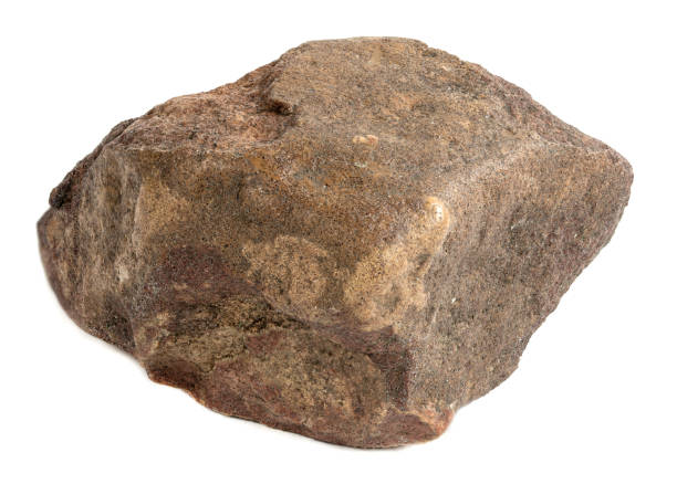 istock A stone on a white background. A piece of red granite 1416088782