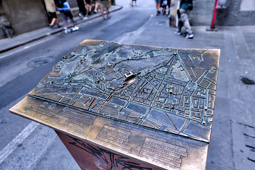 Florence, Italy - July 12, 2022: Brass relief map of Florence, Italy on a street by Piti Palace