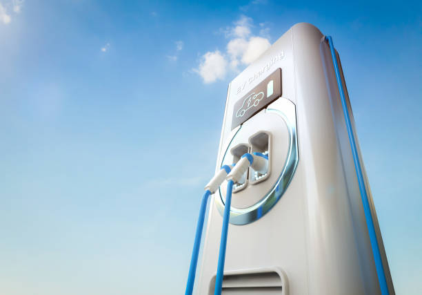 Low angle view of the charging plug plugged in into an electric car while charging