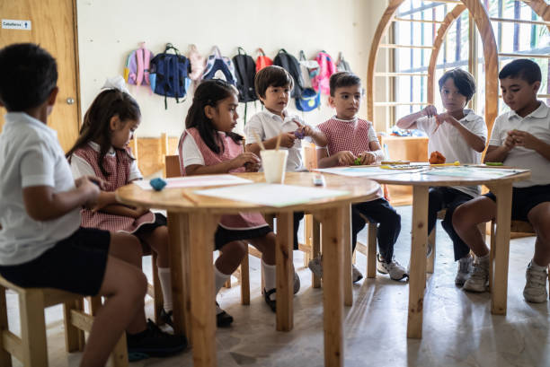 istock Students painting in the classroom at school 1416094344