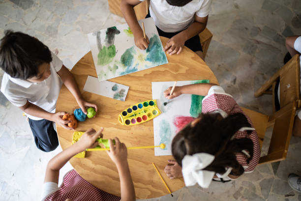 istock Students painting in the classroom at school 1416094351