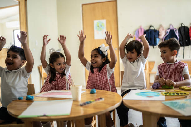 istock Students celebrating in the classroom 1416097847
