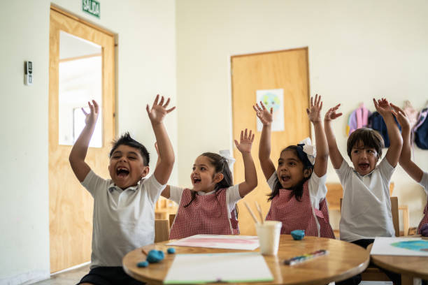istock Students celebrating in the classroom 1416097859