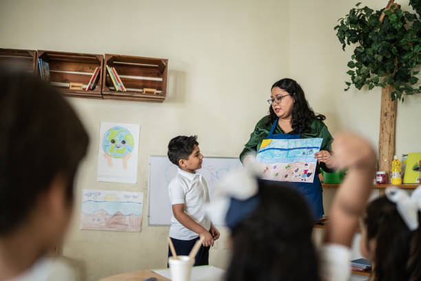 istock Schoolboy presentation in the classroom at school 1416097940