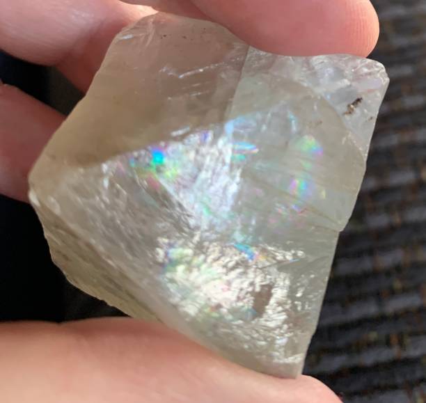 istock Translucent fluorite octahedron crystal with rainbow reflections 1416109529