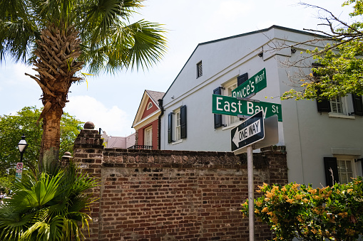 Cityscape of the historic French Quarter residential district along popular East Bay Street with classic homes in Charleston, South Carolina