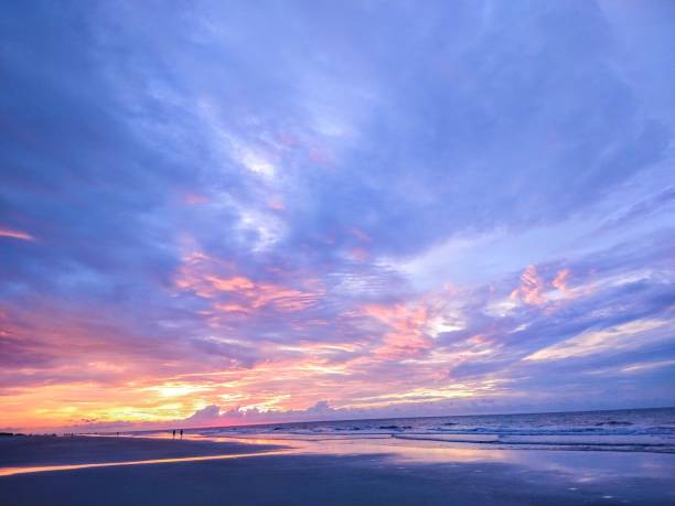 istock Multicolored Beach Sunrise Cloudscape and Inward Water Stream 1416118212