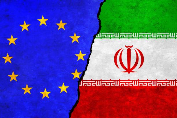 istock European Union and Iran flags on a wall with a crack 1416153456