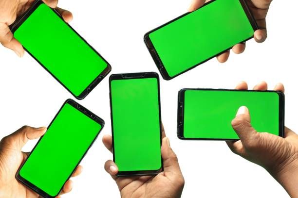 istock Small group people holding smartphone with green screen, transfer data concept 1416154548