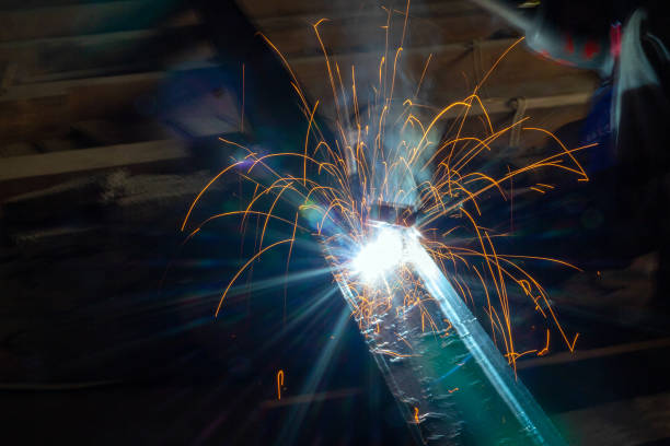 istock Welder in a protective suit and mask at work 1416159881