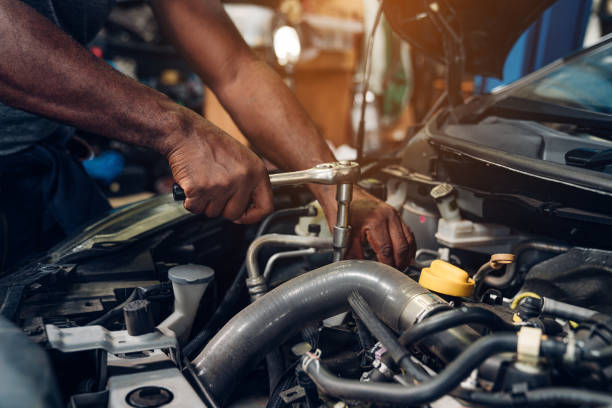 istock Auto mechanic are using the wrench to maintenance auto engine is problems. 1416161679