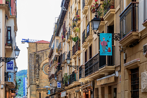 San Sebastian, Spain - June 25, 2021: Basque restaurants and bars famous for pintxos or tapas in the narrow streets of old town Donostia, Basque Country