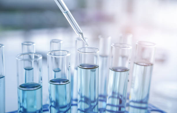 Laboratory research, test tubes with lab glassware. stock photo