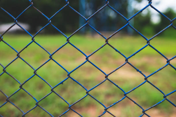 istock Chain link fence with blurred background : demarcation concept 1416164964