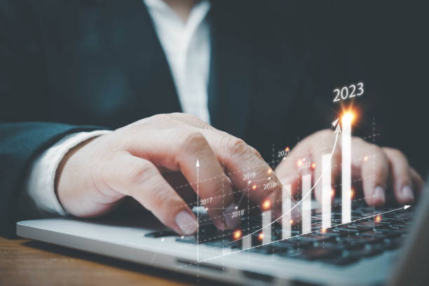 istock Businessman using computer analyzes the profitability of working companies with digital augmented reality graphics, positive indicators in 2023, a business calculates financial data for investments. 1416166461