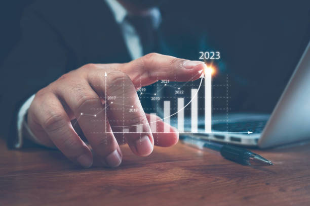 istock Businessman using computer analyzes the profitability of working companies with digital augmented reality graphics, positive indicators in 2023, a business calculates financial data for investments. 1416166465