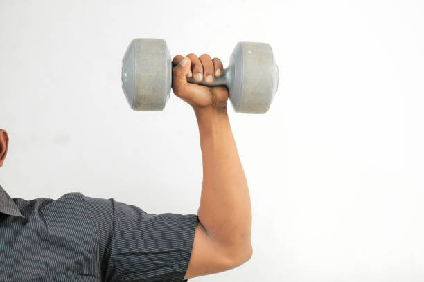 istock Close up hand  lifting dumbell 1416167163