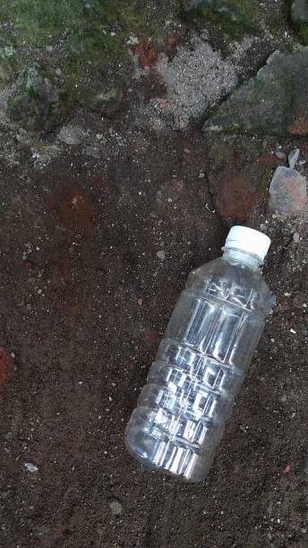 istock Used plastic bottle on the ground 1416170026