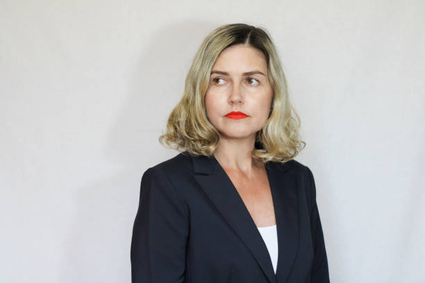 istock Beautiful middle-aged blond woman on a white background 1416180192