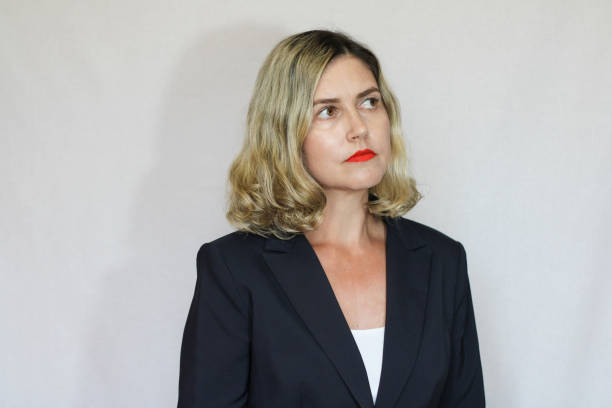 istock Beautiful middle-aged blond woman on a white background 1416180205