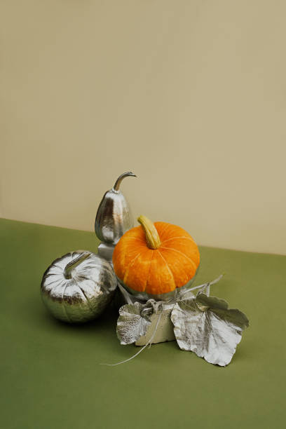 istock Modern still life with various pumpkins decorated in silver on a podium made of bricks 1416184669