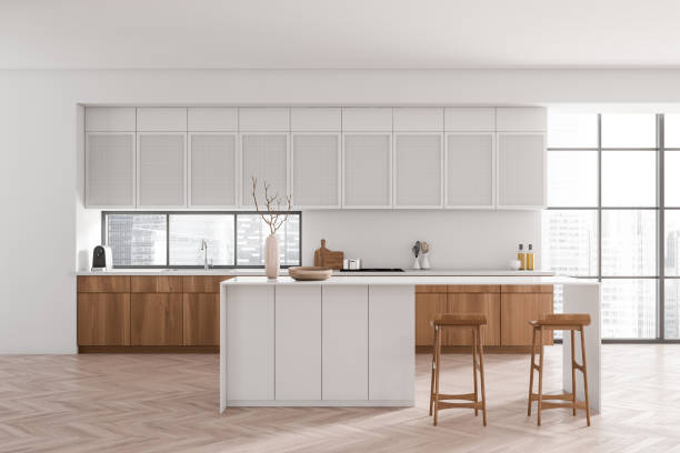 istock Light kitchen interior with island and seats, appliances and panoramic window 1416188734