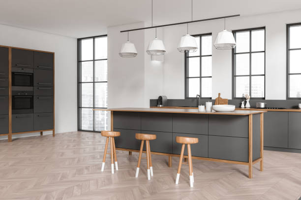 istock Light kitchen interior with countertop and seats, hidden shelves and window 1416188794