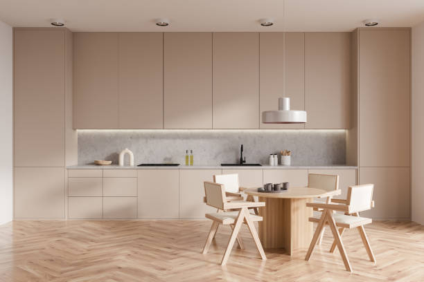 istock Light kitchen interior with eating table and seats on wooden floor 1416188837