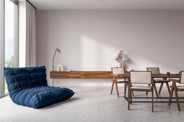 istock Light relax room interior with eating table and soft place, panoramic window 1416190073