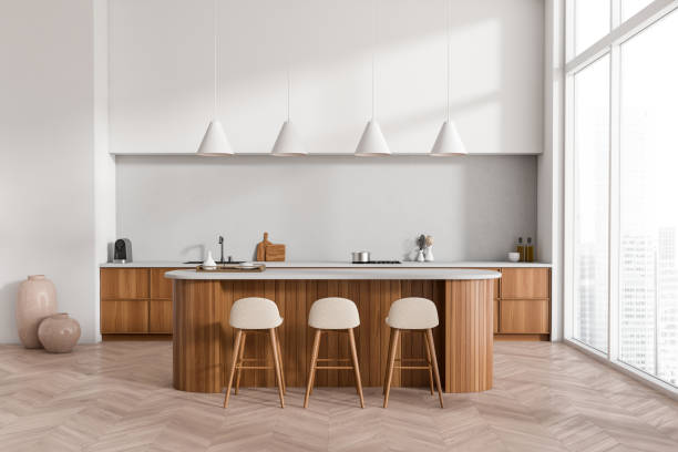 istock Light kitchen interior with island and seats, kitchenware and panoramic window 1416190235