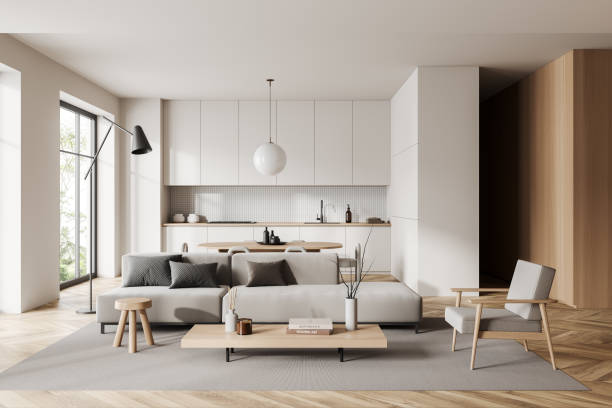 istock Studio interior with relax space and eating zone, hidden shelves and window 1416190312