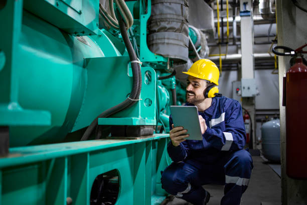 istock Power plant engineer controlling gas generator inside factory. Electricity production. 1416206865