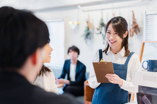 istock Young staff taking orders at a cafe 1416207853