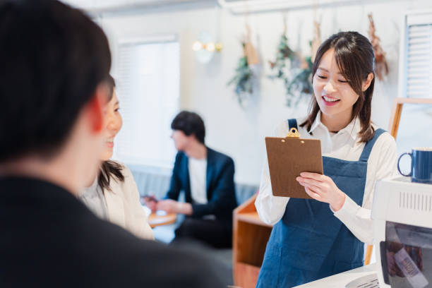 istock Young staff taking orders at a cafe 1416207915