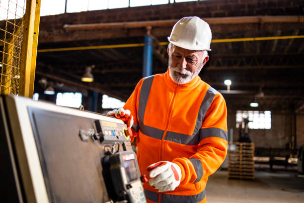 istock Industrial technician operating production machine in factory. 1416207963