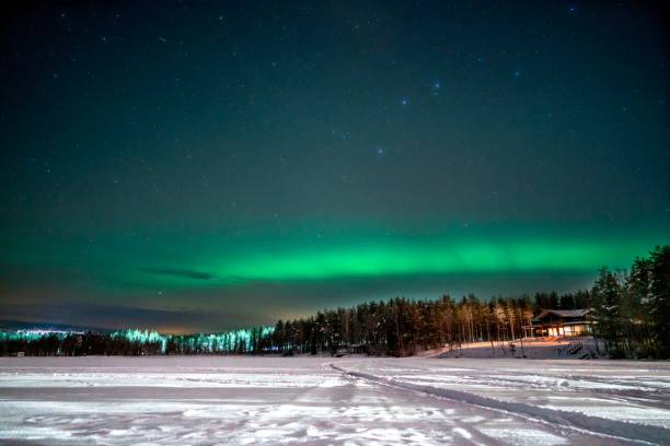 istock Northern lights over a frozen lake 1416211490