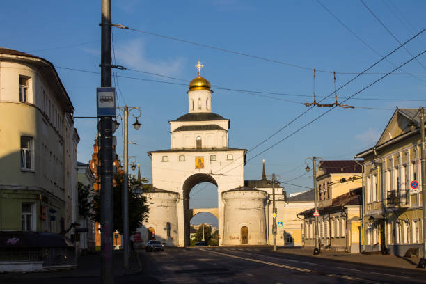 golden Gate in the historical center of the city Vladimir: white stone golden Gate in the historical center of the city on a sunny summer day and blue sky golden gate vladimir stock pictures, royalty-free photos & images