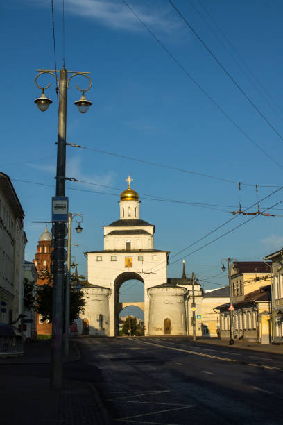 golden Gate in the historical center of the city Vladimir: white stone golden Gate in the historical center of the city on a sunny summer day and blue sky golden gate vladimir stock pictures, royalty-free photos & images