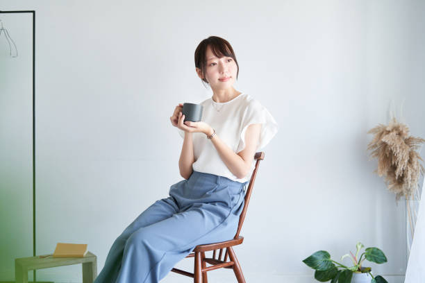 istock A woman relaxing in a simple space 1416270515