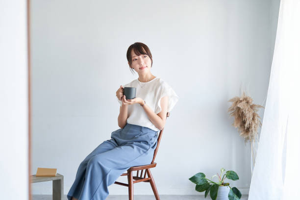 istock A woman relaxing in a simple space 1416271075