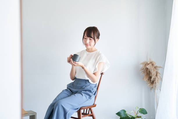 istock A woman relaxing in a simple space 1416271619