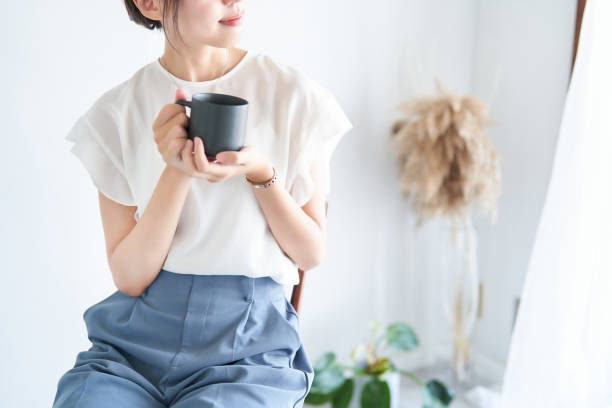 istock A woman relaxing in a bright indoor space 1416274799