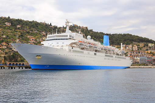 Alanya, Turkey - 07 april, 2015: Large white cruise liner moored in the port of Alanya