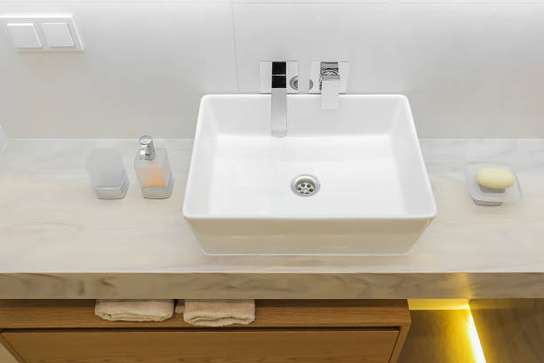istock Modern white bathroom sink with faucet 1416304396