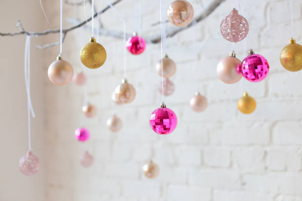 istock Colored Christmas balls hang on a branch 1416308138